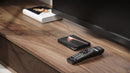 Formuler Z12 Ultra media player and BT3 remote on wooden media console under a TV